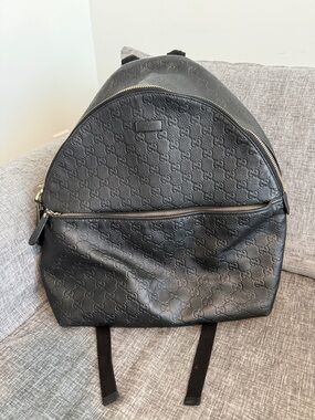 Gucci Black Leather Backpack-Embossed with Gold Hardware